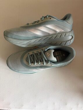 adidas Women's Light Blue Athletic Running Shoes with White Stripes